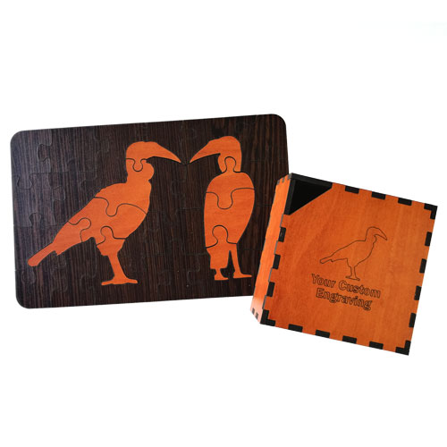 Wooden bird puzzle set with engraved storage box.